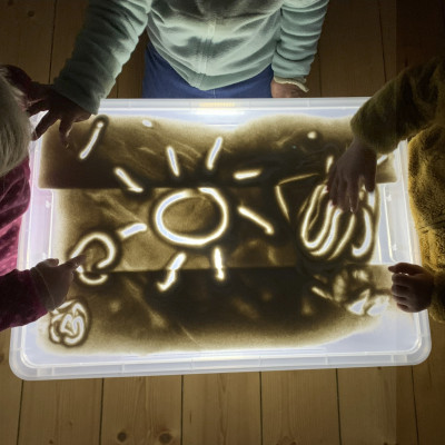 Sand auf der Lichtbox